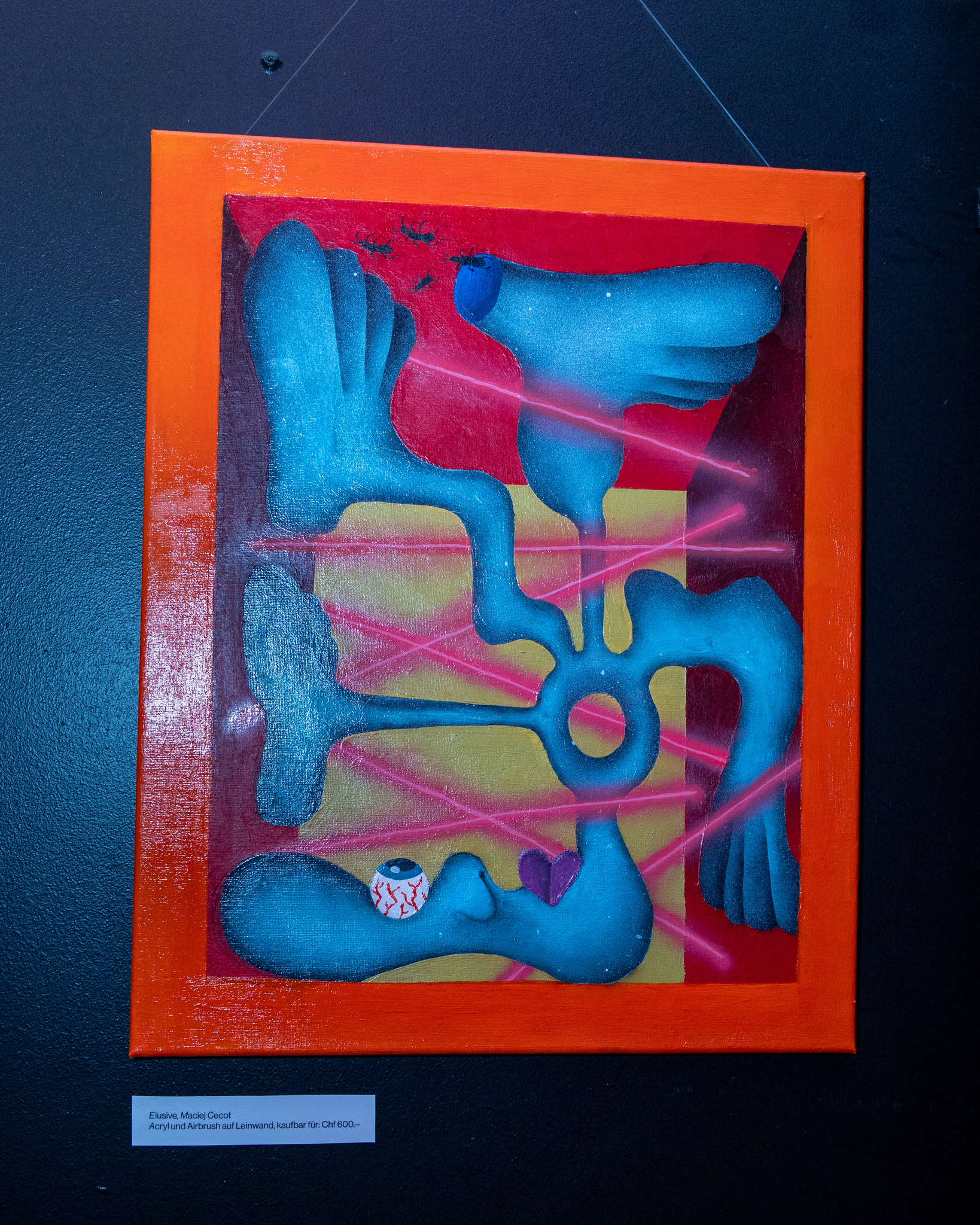 Abstraktes Gemälde im orangenen Rahmen